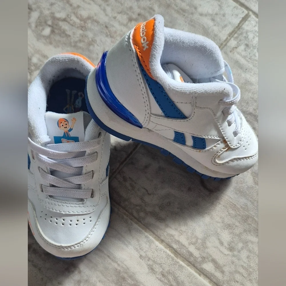 Reebok Kids Sneakers in White and Blue with Orange Accents